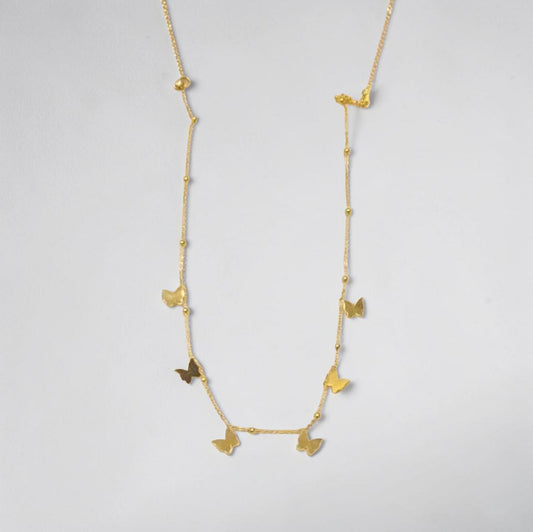 Gold necklace with butterfly pendants on a light gray background | Butterfly Necklace 18k gold plated water proof and stainless steel by Efforro Pakistan 