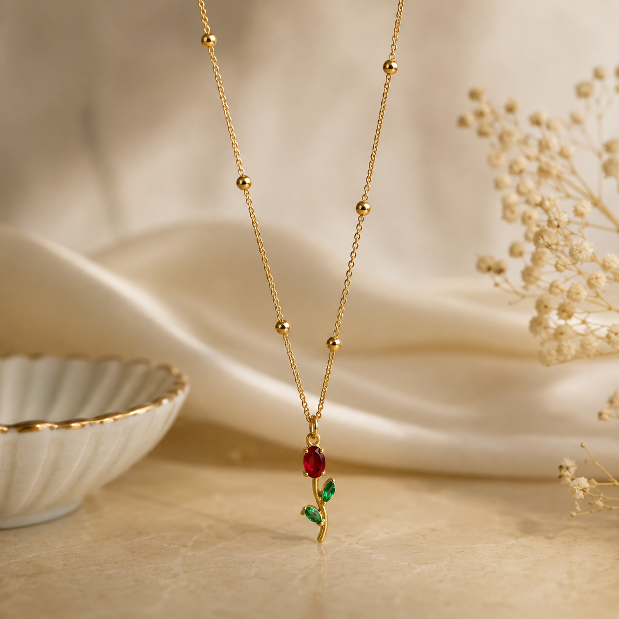Tulip necklace with a red and green pendant 18k gold plated stainless steel and tarnish free and water resistant by efforro.