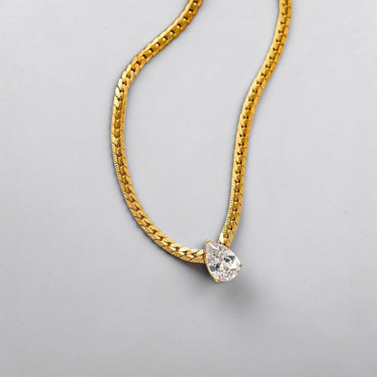 Elegant gold teardrop pendant necklace, 18K gold plated stainless steel with CZ stone.

Minimalist pear shaped cubic zirconia pendant on gold chain waterproof everyday jewelry in Pakistan Efforro
